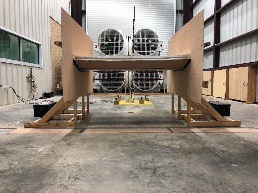 A bridge-deck sectional model in front of the open-jet fan array