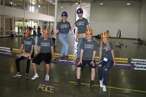 The steel bridge team with its bridge at competition